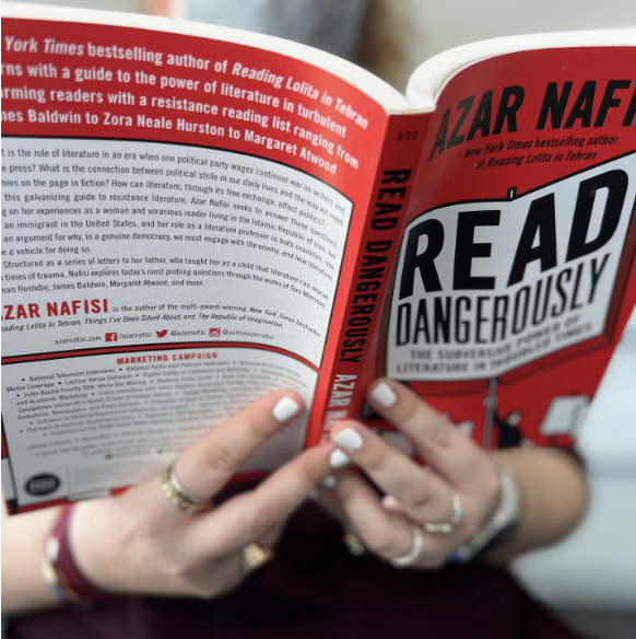 photo of holly holding Read Dangerously by Azar Nafisi